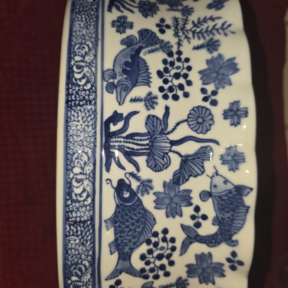 Blue and White Ceramic Bowl with Fish Design